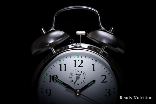 Alarm clock in the middle of the night isolated on black concept for insomnia Alarm clock in the middle of the night isolated on black concept for insomnia