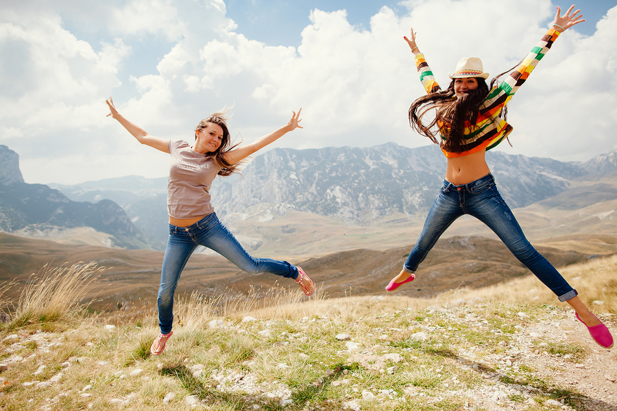 Happy Women Travel And Jump Together Happy Women Travel And Jump Together