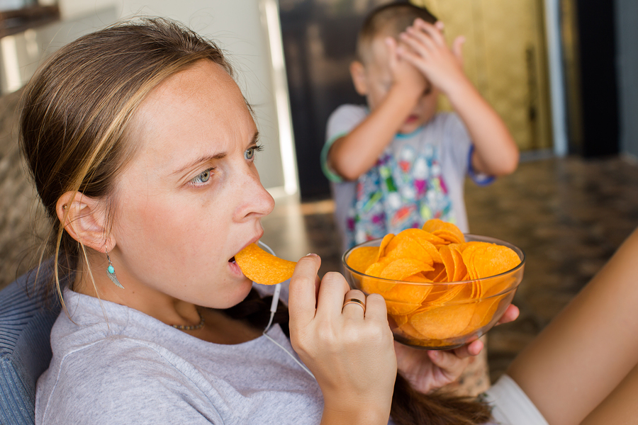 Woman Works At The Computer And Eating Fast Food. Unhealthy Life Woman Works At The Computer And Eating Fast Food. Unhealthy Life