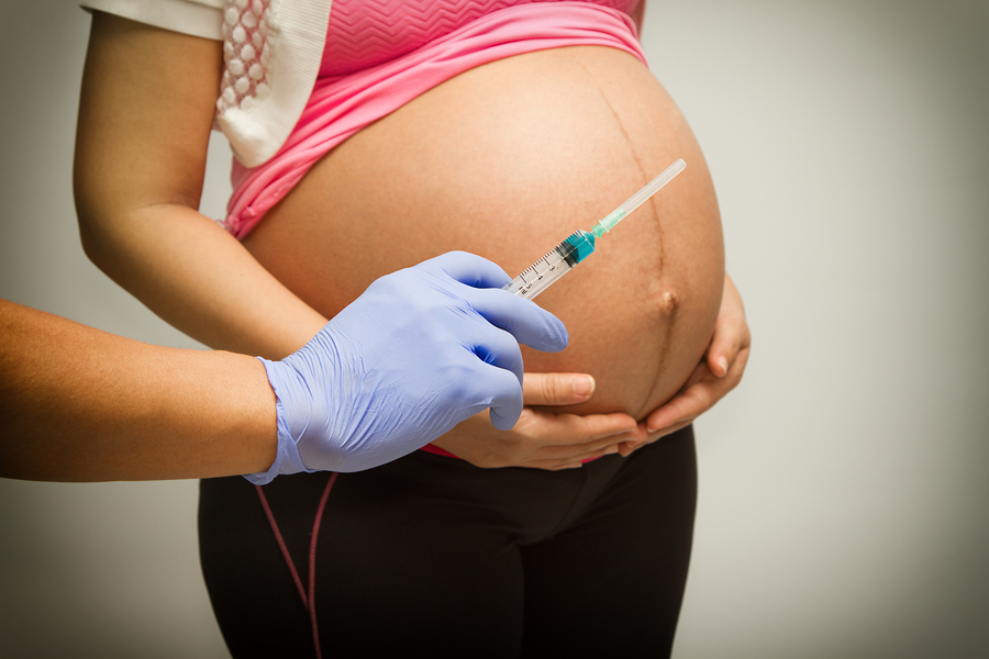 Pregnant Woman With Syringe ,vaccinating A Pregnant Woman Pregnant Woman With Syringe ,vaccinating A Pregnant Woman