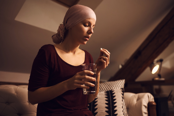Woman-suffering-from-cancer-taking-medicine-1 Woman-suffering-from-cancer-taking-medicine-1