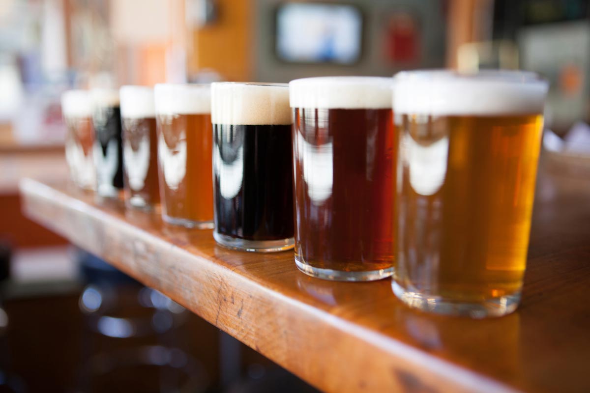 Row-Of-Beer-Tasters-Lined-Up-In-A-Brewpub Row-Of-Beer-Tasters-Lined-Up-In-A-Brewpub