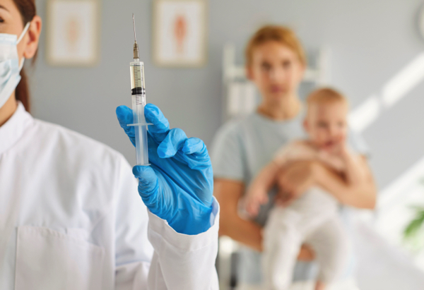 female-professional-nurse-doctor-with-flu-coronavirus-vaccine-1