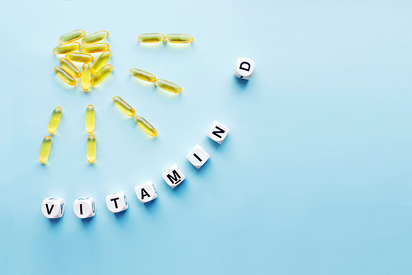 Yellow capsules in the form of the sun with rays and the word vi Yellow capsules in the form of the sun with rays and the word vi